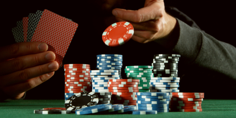 An image capturing the moment a player lays down a bet in a lively poker setting